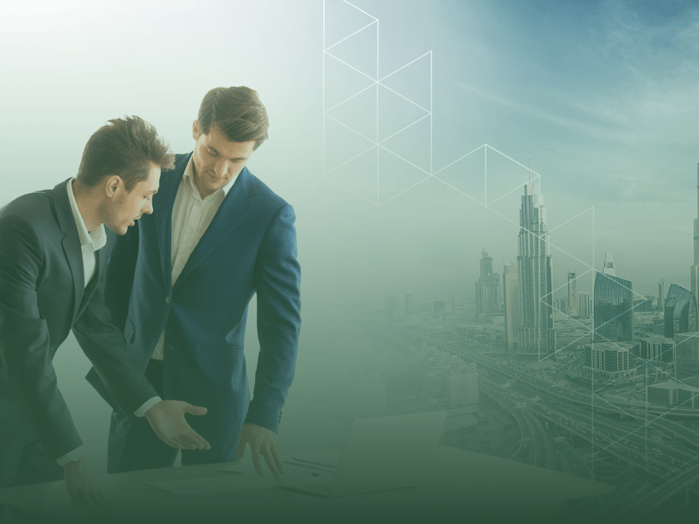 Businessmen discussing over laptop with a futuristic cityscape representing business setup in Thailand.