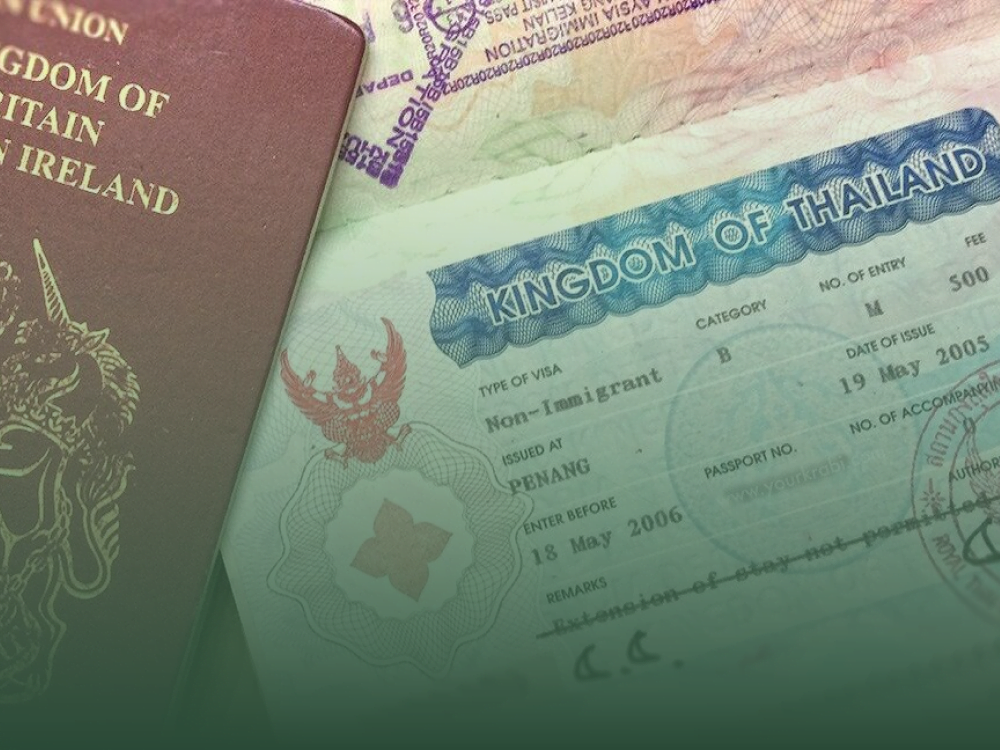 Close-up of passports with Thailand long-term visa stamps (Long-Term Visa in Phuket)